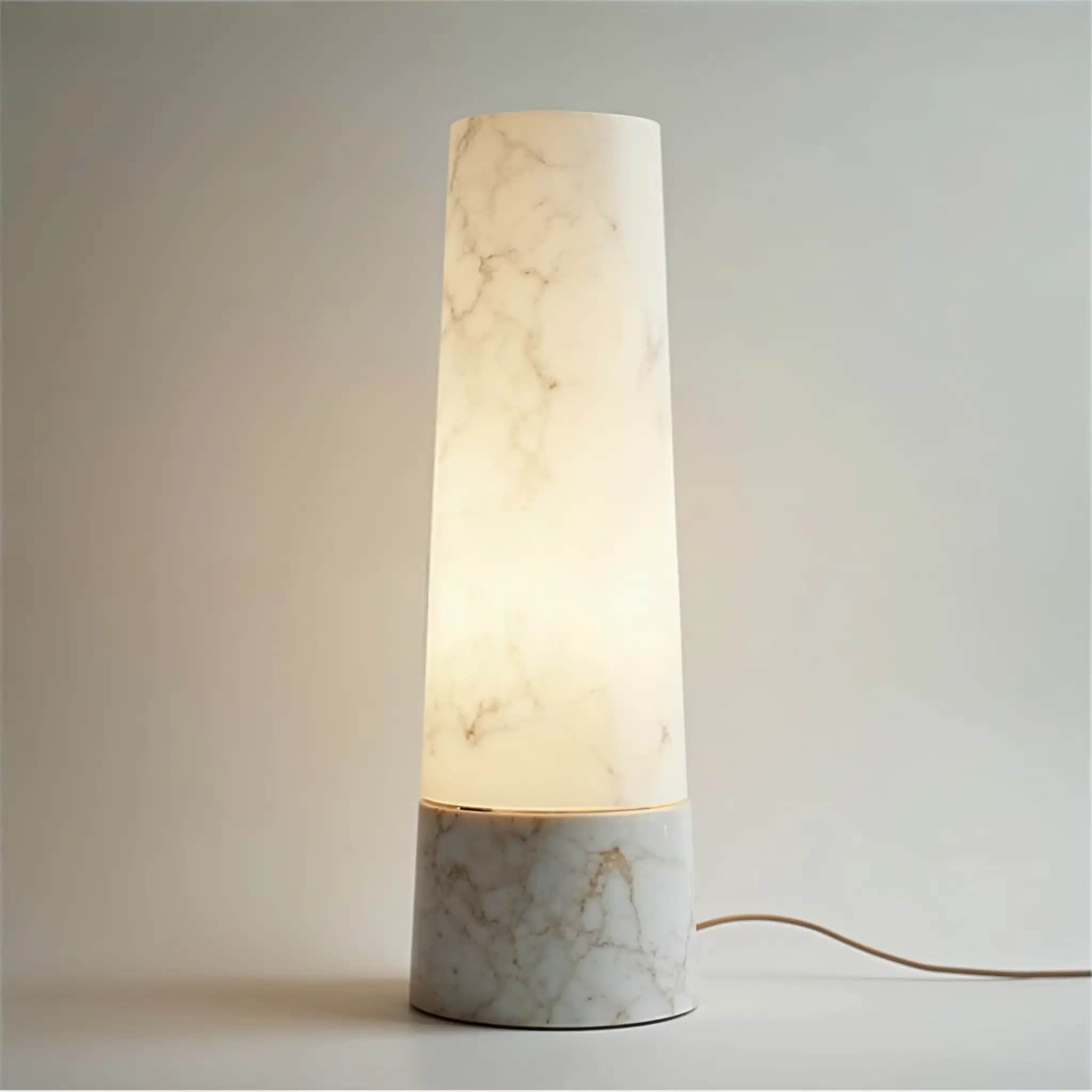Alba table lamp with a glowing Muğla White marble shade on a marble base