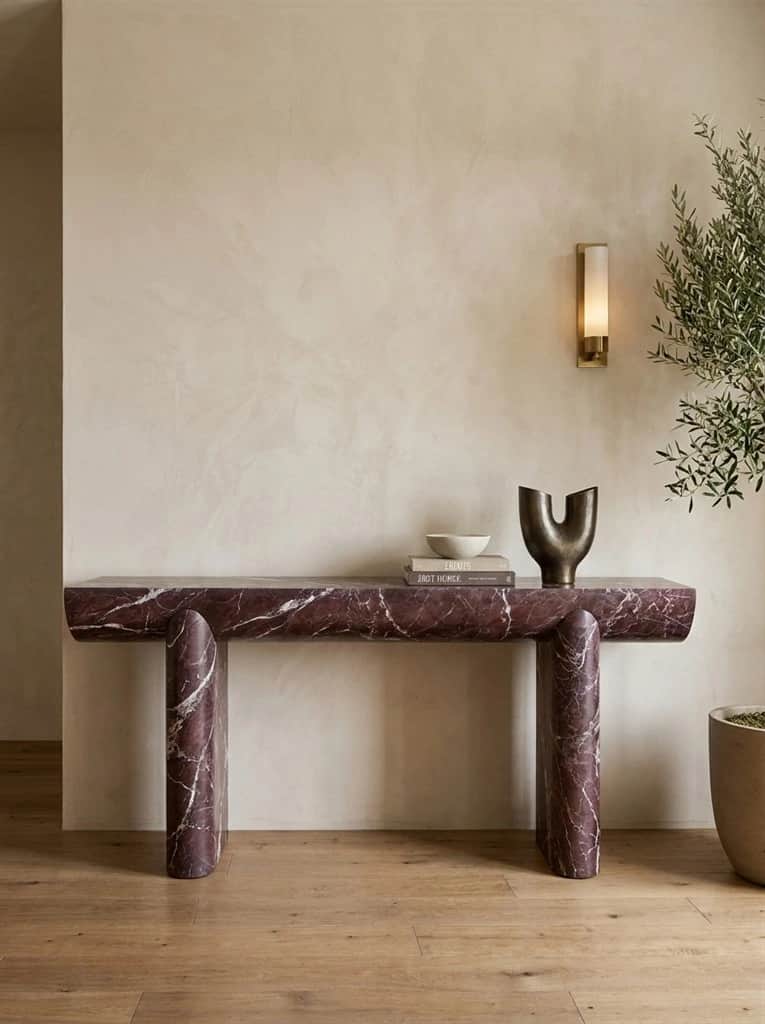Cove Rosso Levanto marble console with rounded ends and carved supports