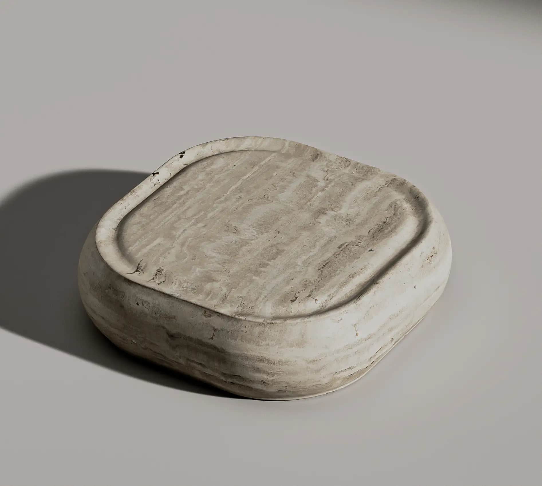 Obiva low sculpted marble coffee table with a recessed top