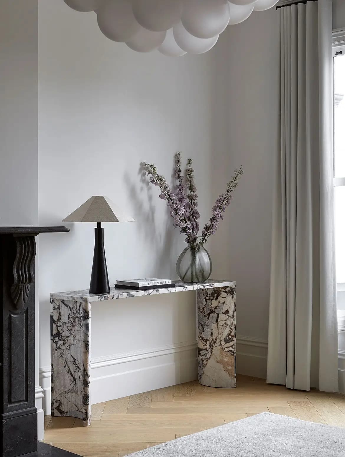 Statement marble console styled in a bright residential interior