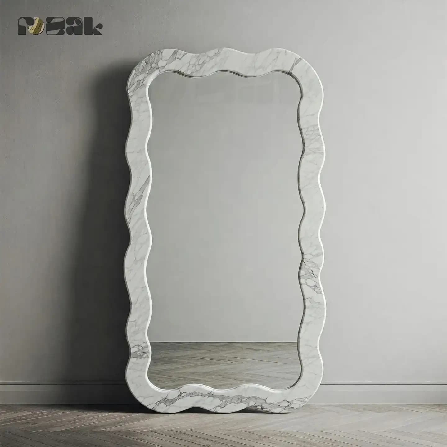 A full-length mirror framed in Carrara marble with a soft wavy outline