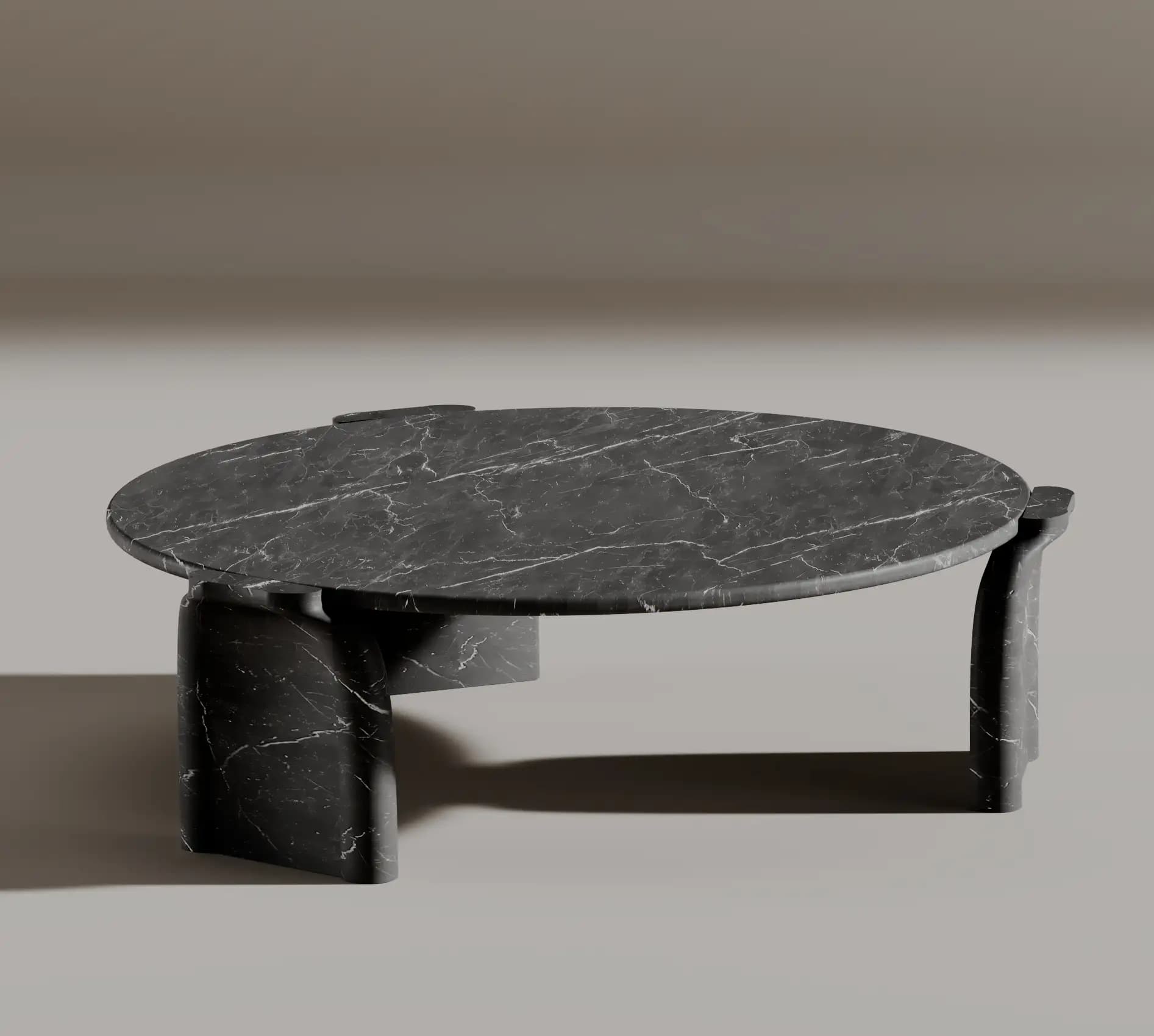 Glade round black marble coffee table on two curved sculpted supports