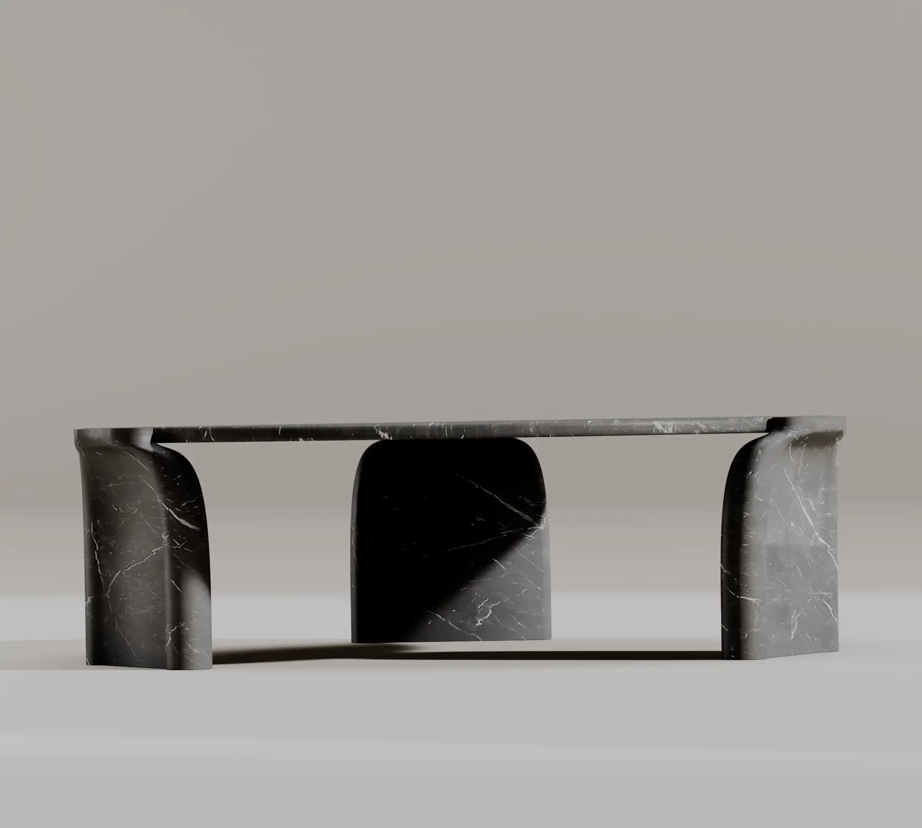 Side profile of the Glade black marble coffee table and its sculpted supports