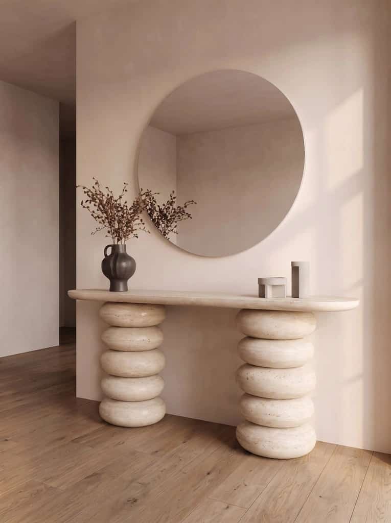Cairna travertine console with two stacked rounded sculptural supports