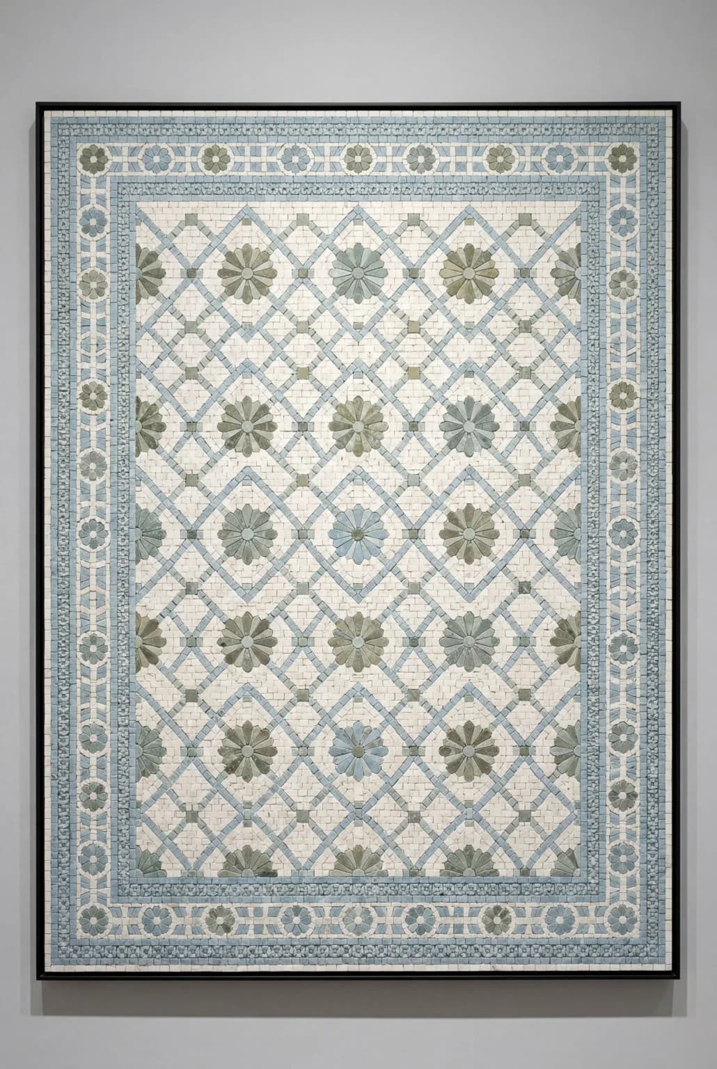 Asterra marble mosaic panel with green floral medallions in a pale blue diamond lattice and decorative border