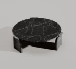 Sculpted black marble coffee table in a modern interior